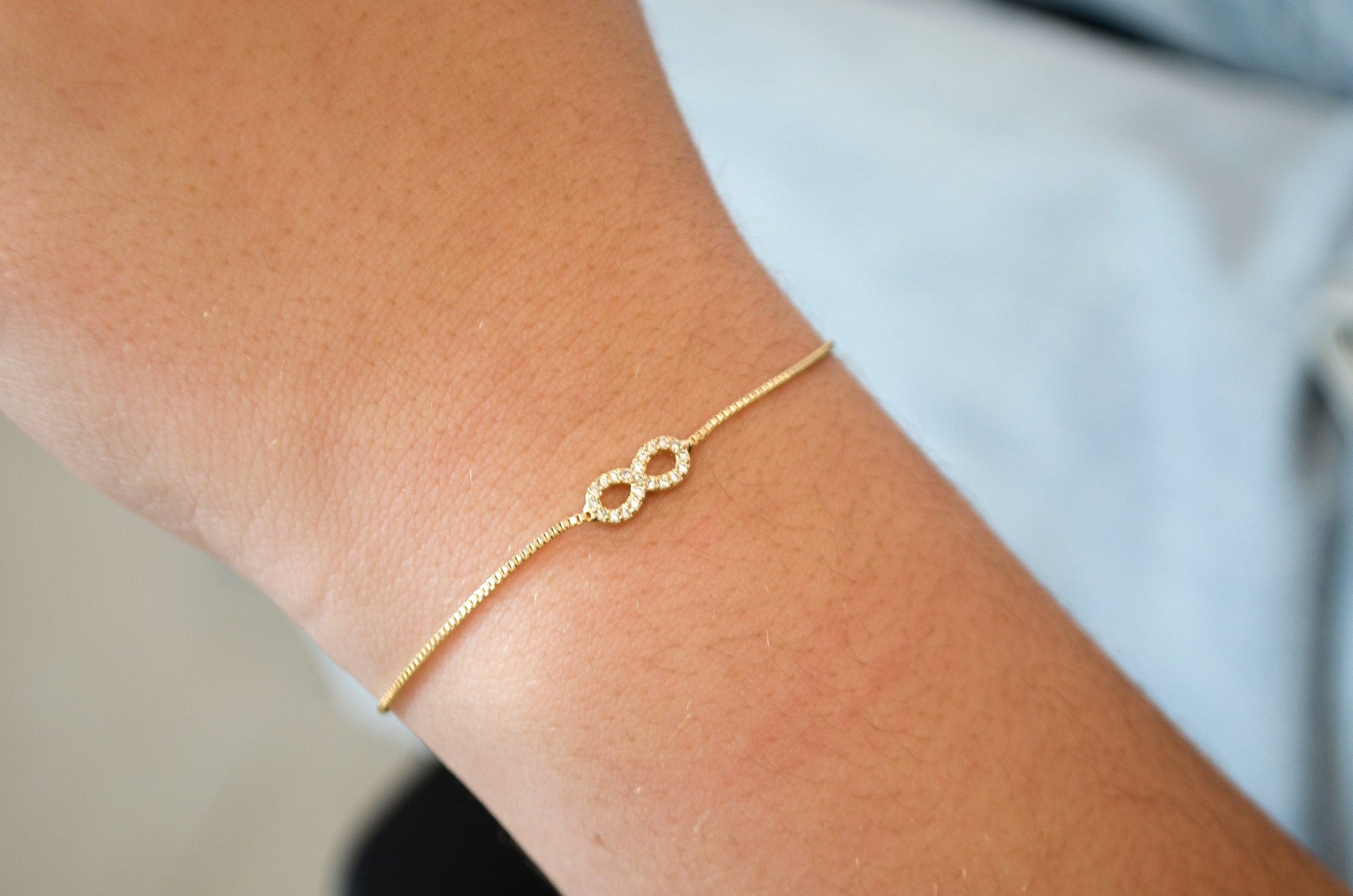 Pulseira regulável com infinito de zircônias banhada a ouro 18k - Biju & Cia.