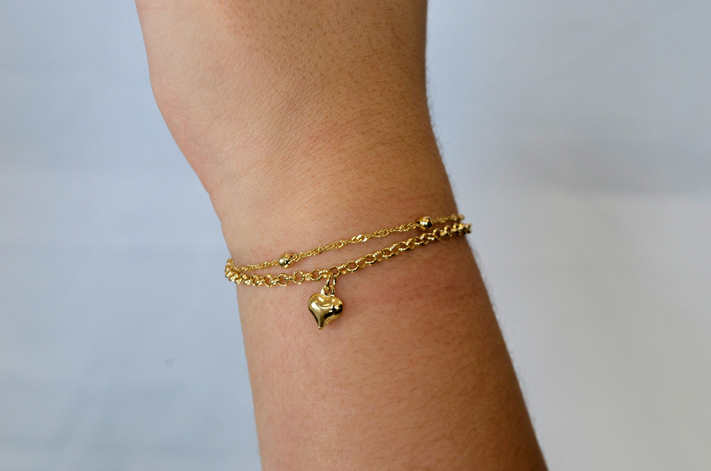 Pulseira dupla com bolinhas e coração banhada a ouro 18k - Biju & Cia.
