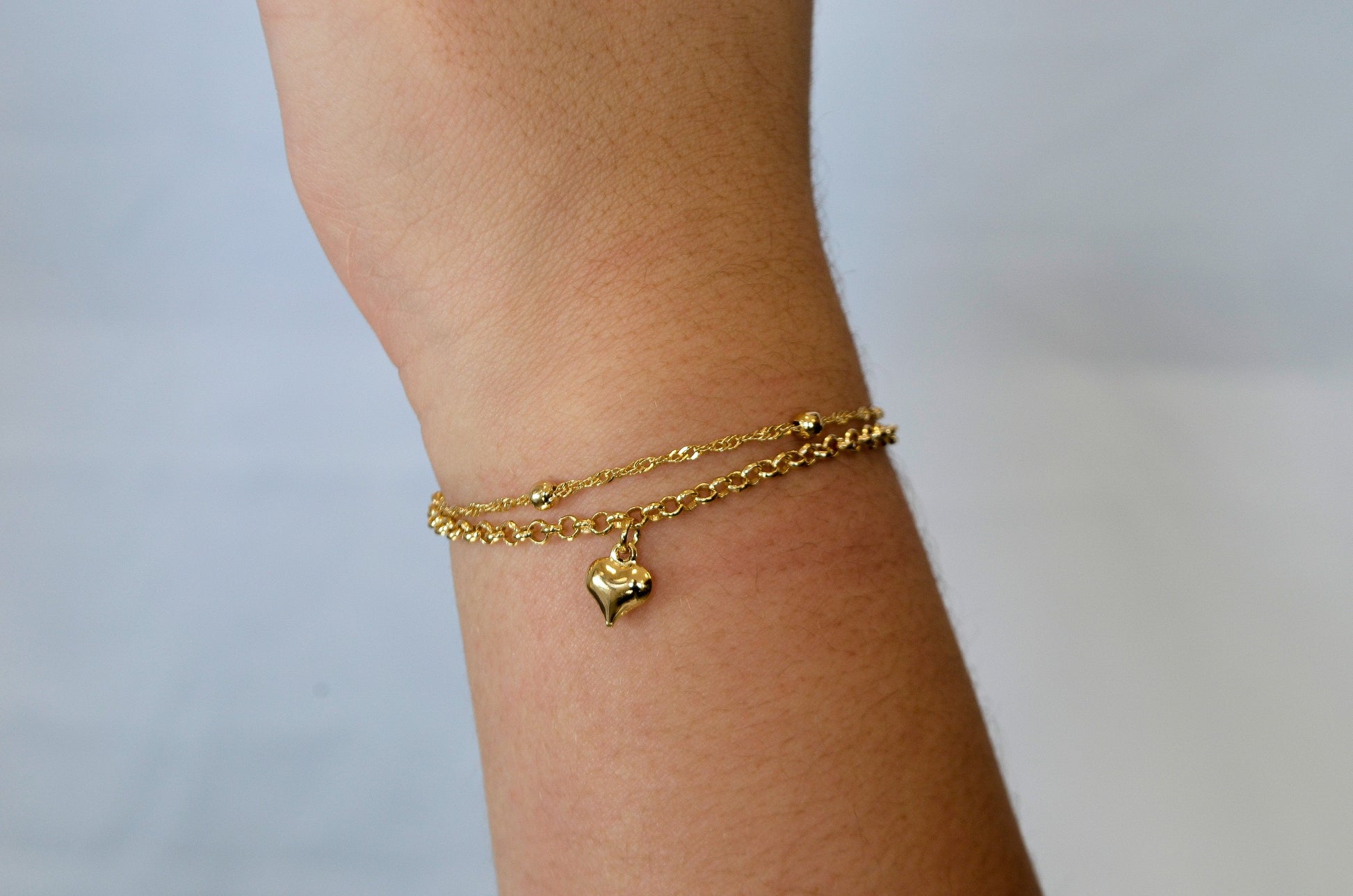Pulseira dupla com bolinhas e coração banhada a ouro 18k - Biju & Cia.
